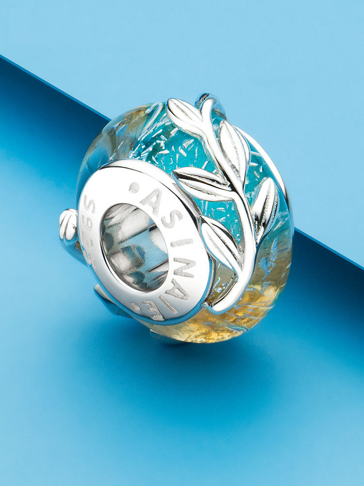 Olive leaf Murano glass charm bead styled on bracelet