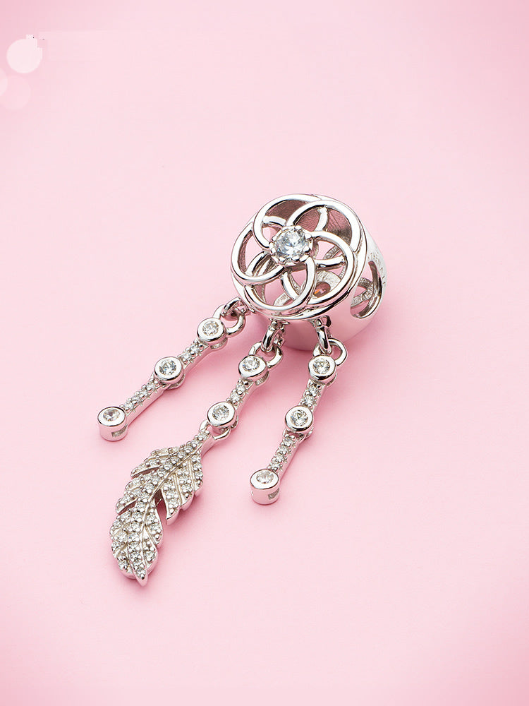 Dream catcher charm styled on European-style charm bracelet