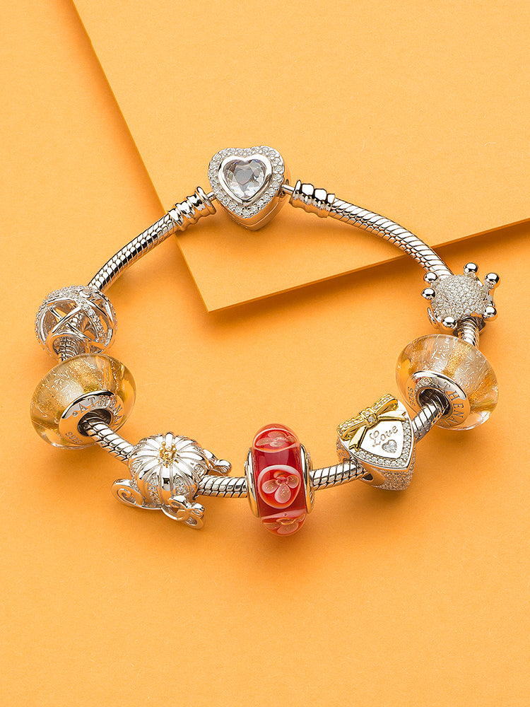 Fantasy pumpkin carriage charm paired with silver bracelet