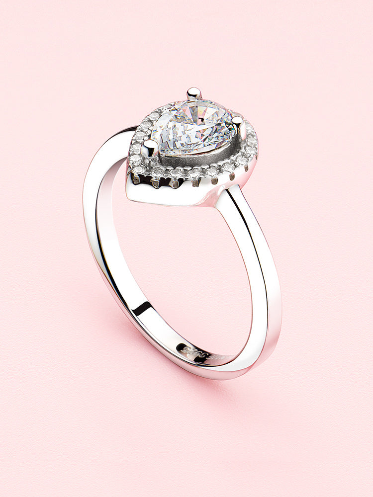 Sterling silver pear halo engagement ring styling scene