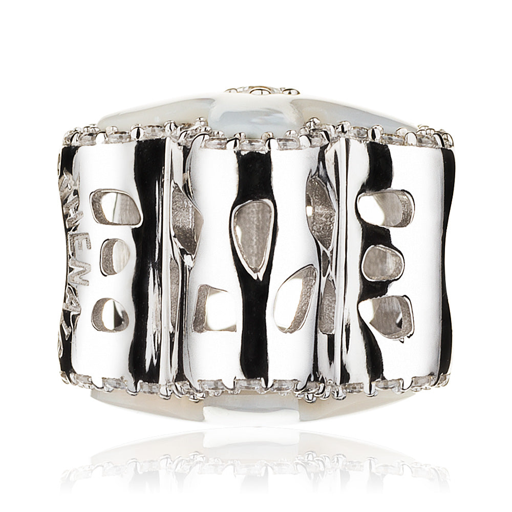 Side view of Pearl Bloom charm bead showing 3D floral silhouette, shell inlay and pavé CZ setting on sterling silver base