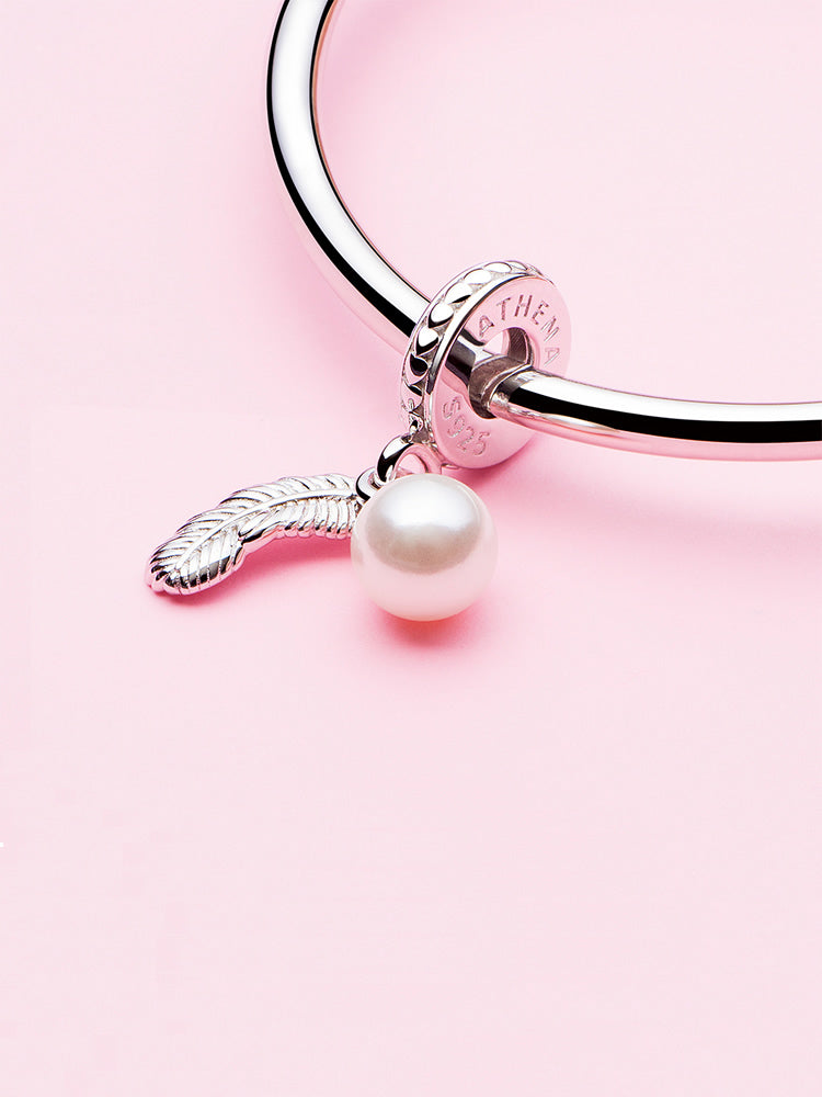 Pearl feather sterling silver dangle charm on bracelet