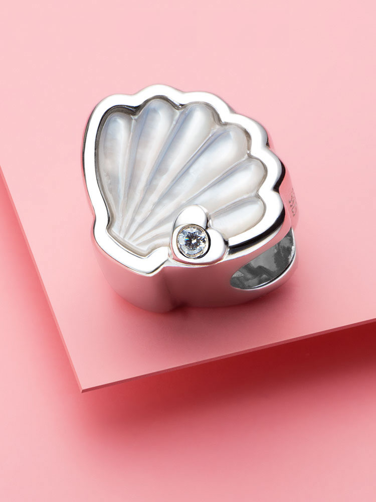 Pearl shell sterling silver charm bead styled on bracelet