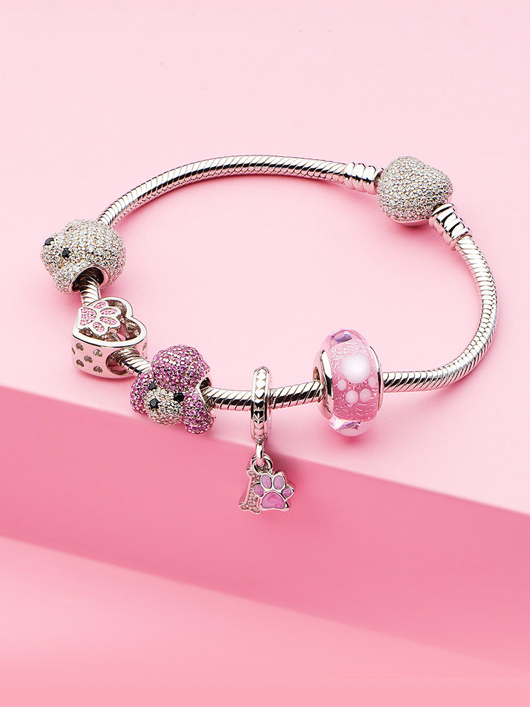 Detailed bracelet styling with pink paw Murano glass charm bead