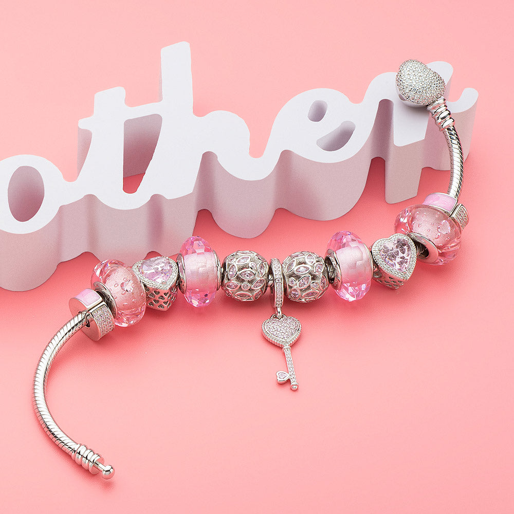 925 silver charm with pink CZ shown on matching ATHENAIE bracelet