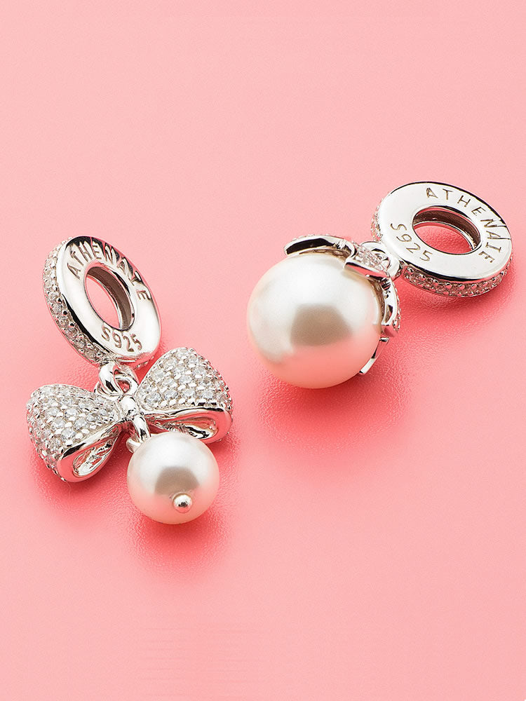 Petal pearl charm pendant styled on sterling silver charm bracelet