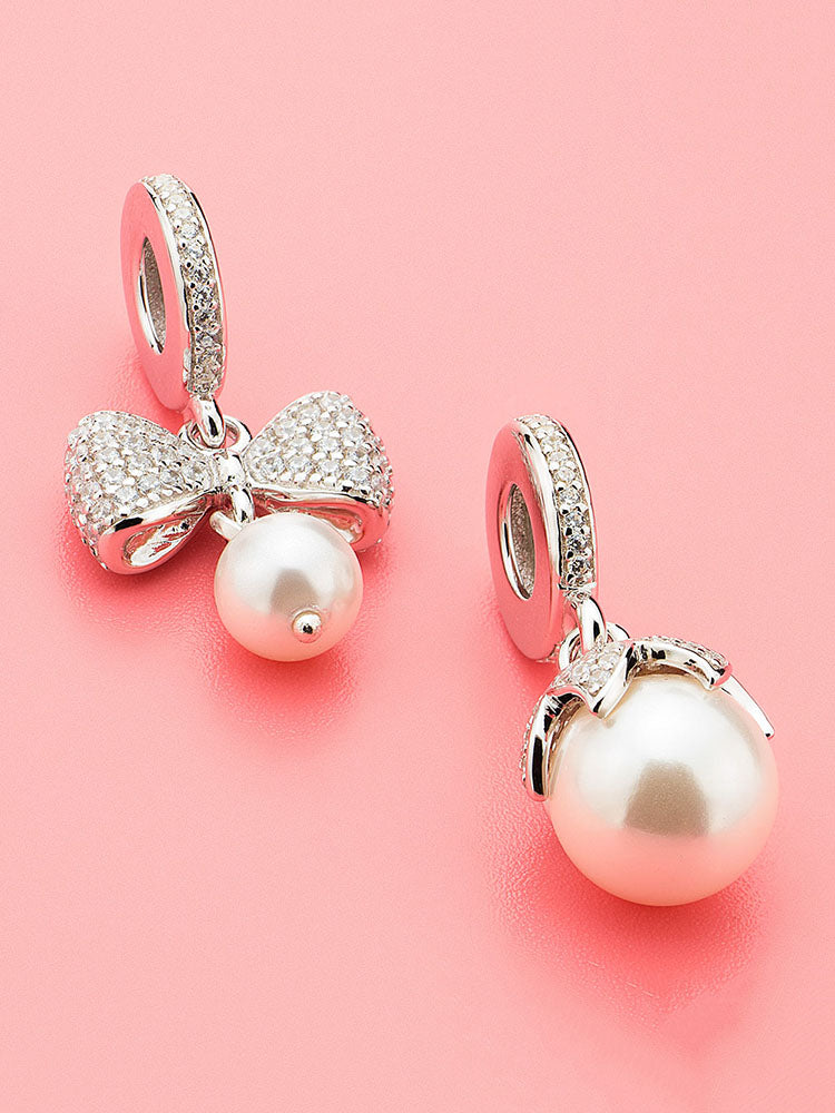 Petal pearl charm pendant styled on sterling silver charm bracelet