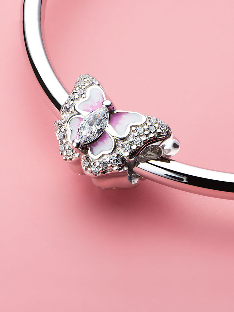 Pink butterfly enamel charm bead styled on bracelet