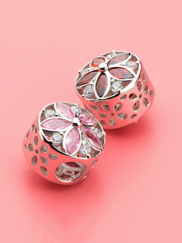 Pink charm bead styled with charm bracelet beads