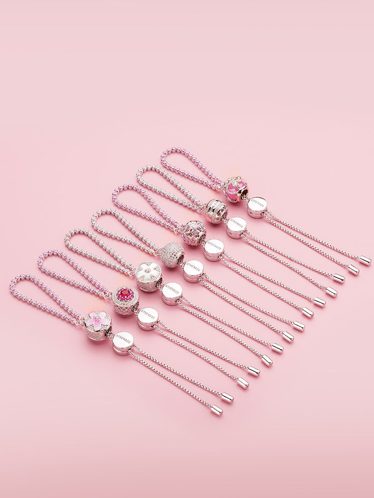 Sterling silver adjustable charm bracelet with pink CZ styling