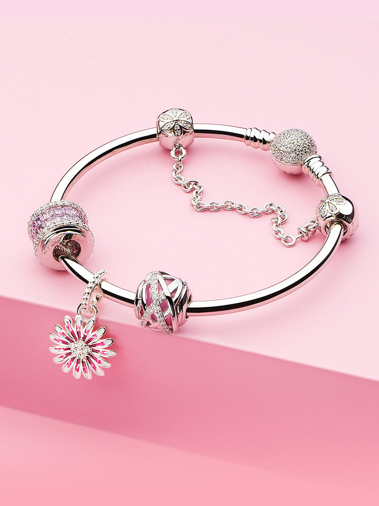 Detailed bracelet styling with Pink Embrace sterling silver charm bead