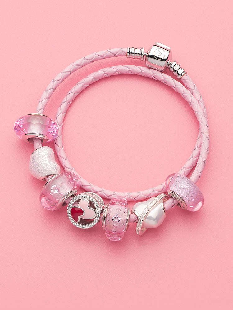 Pink enamel heart charm paired with silver bracelet stack blossom charm bead by ATHENAIE