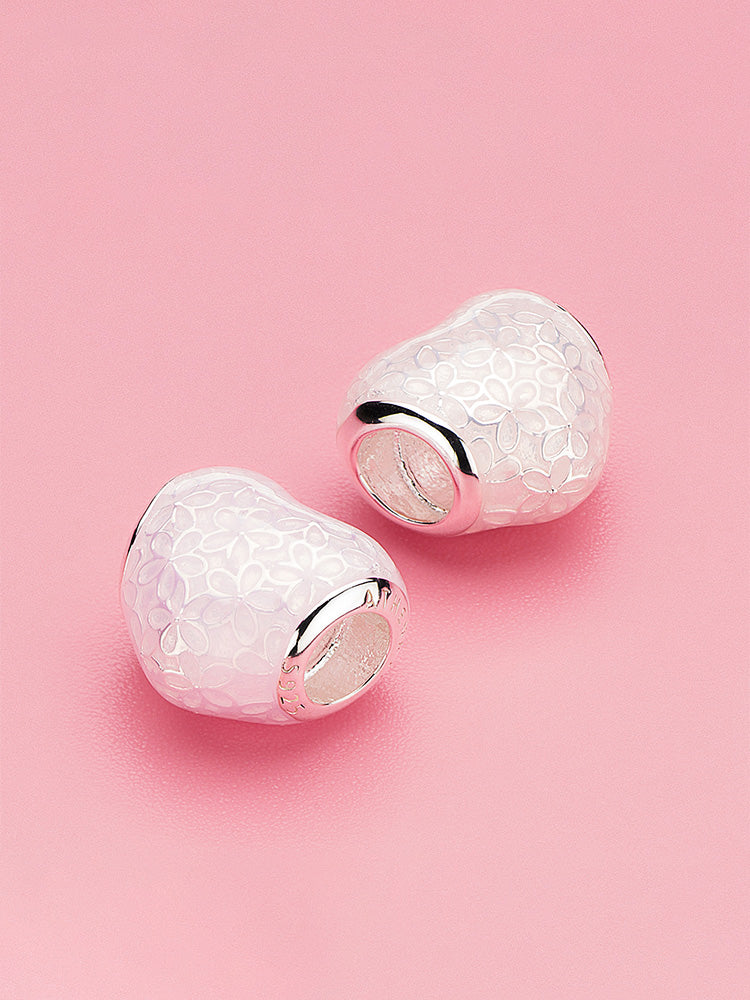 Pink enamel heart charm bead styled on bracelet showing blossom silver design by ATHENAIE