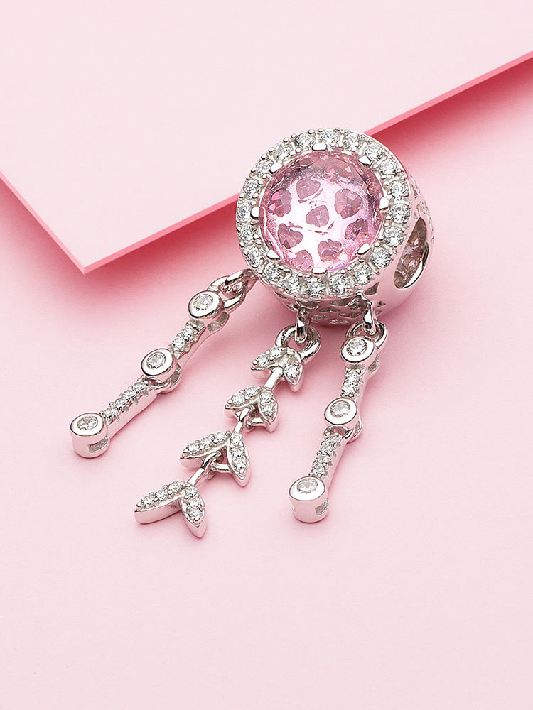 Close-up of the pink halo dream catcher charm