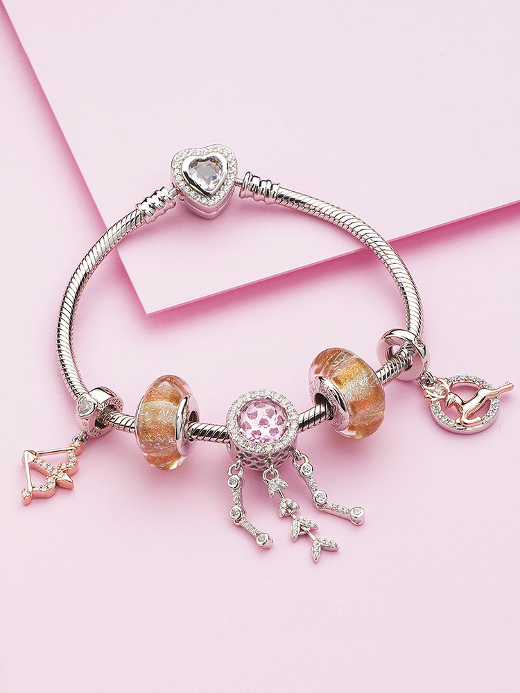 Pink halo dream catcher charm on a silver charm bracelet