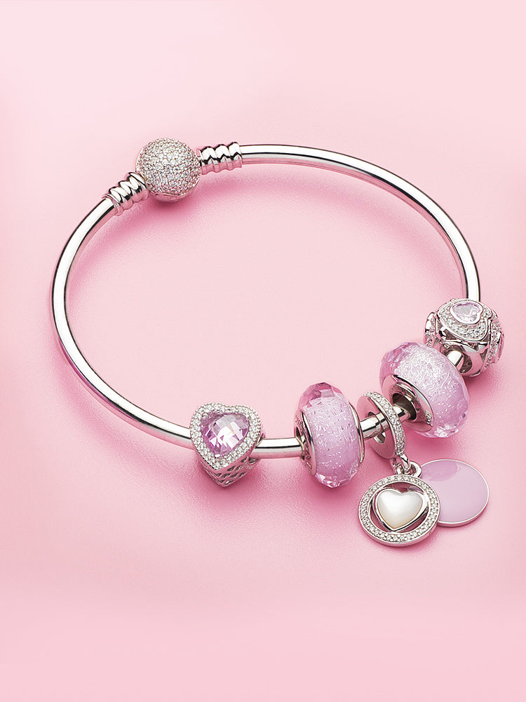 Pink heart charm bead styled on charm bracelet by ATHENAIE