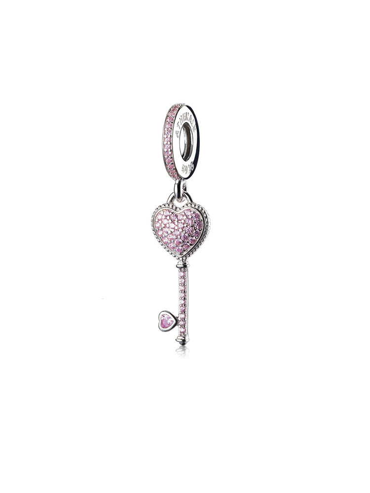 Pink heart key dangle charm in 925 sterling silver with CZ, front view