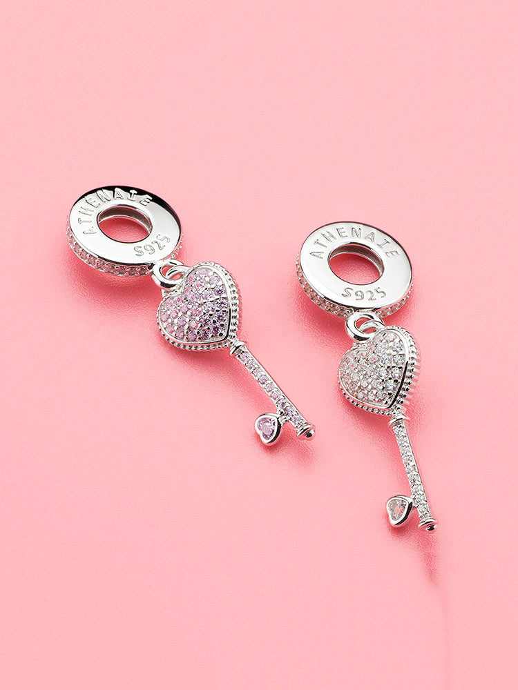 Pink heart key dangle charm with other charms