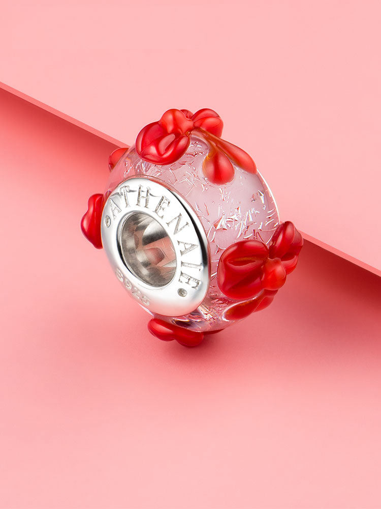 Pink Murano glass bow charm bead on bracelet