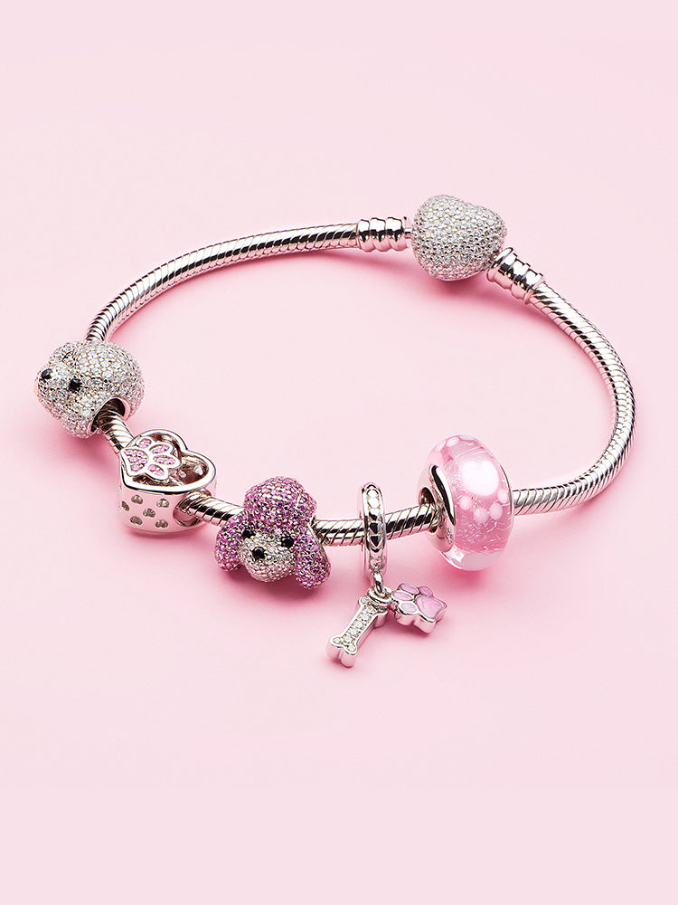 Pink paw Murano glass charm bead styled on charm bracelet