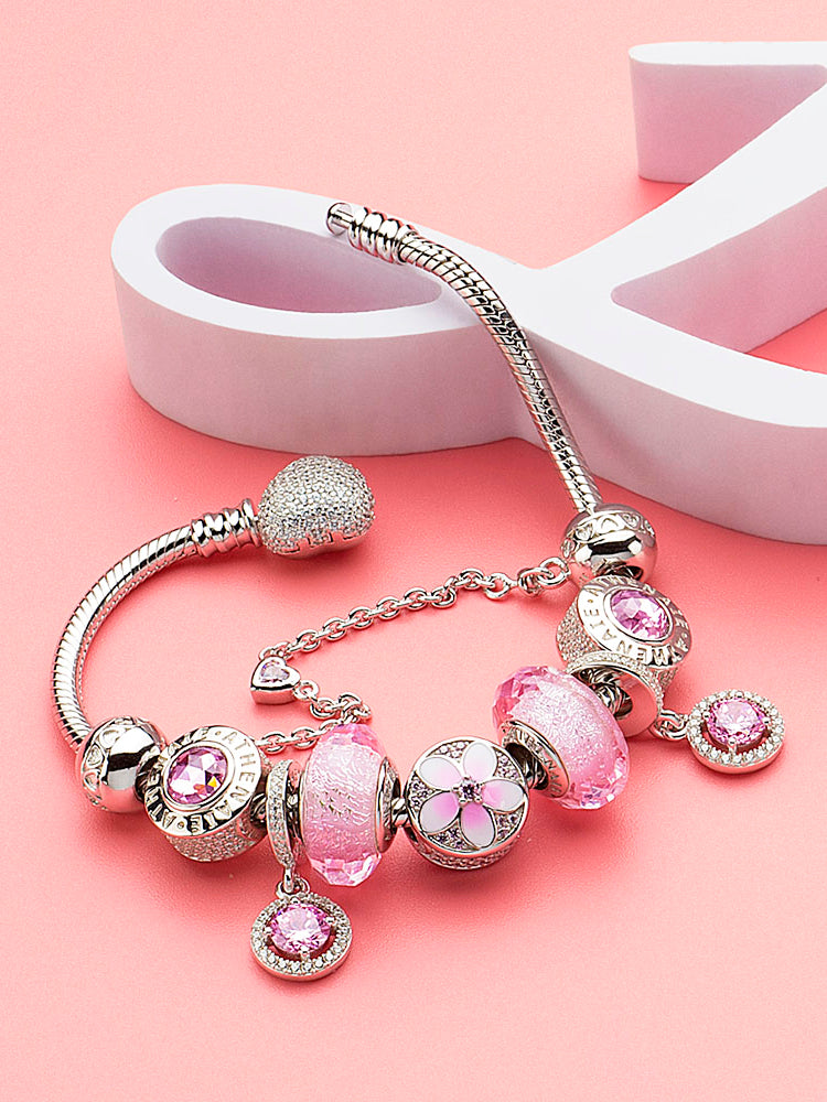 Pink halo pendant charm styled on silver charm bracelet