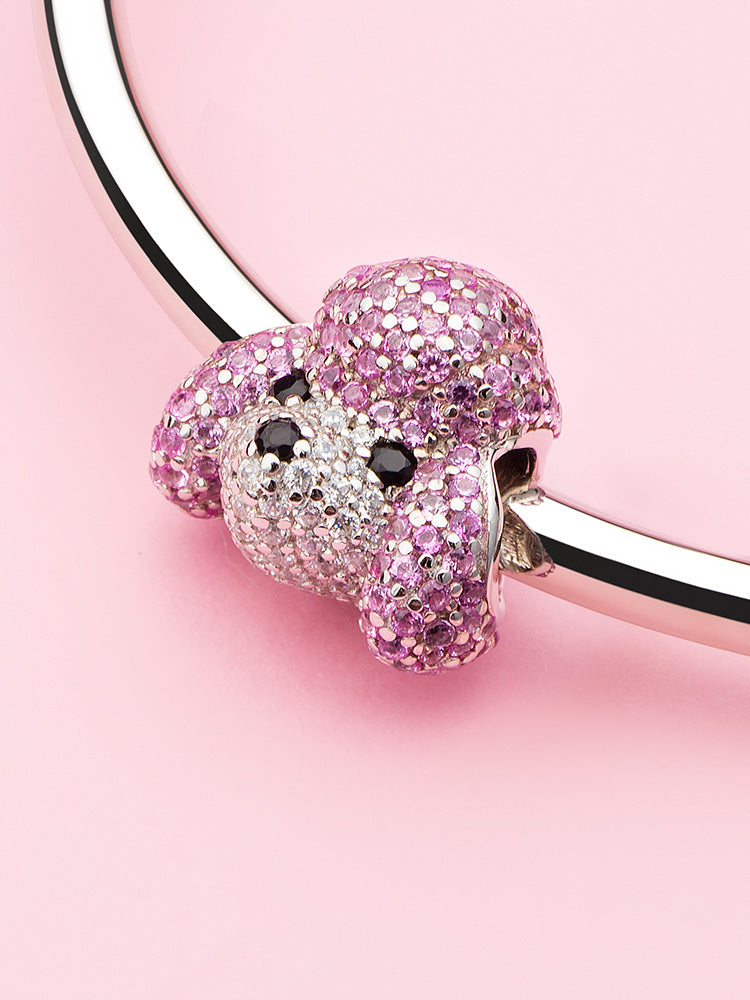 Pink poodle sterling silver charm bead displayed on charm bracelet