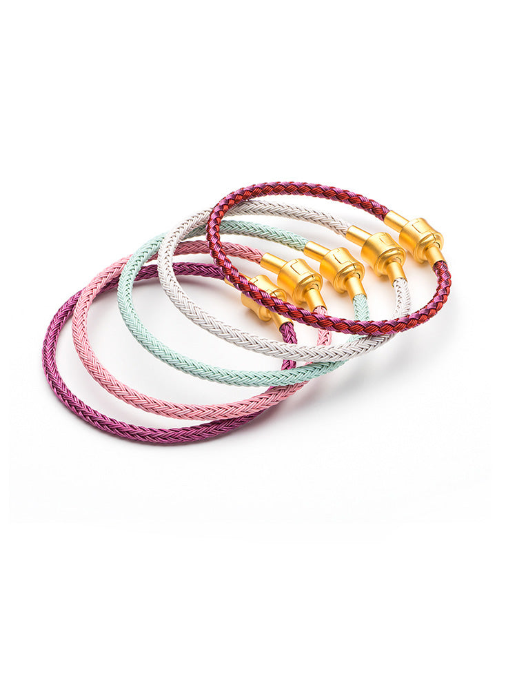 Blush pink braided rope charm bracelet with gold clasp