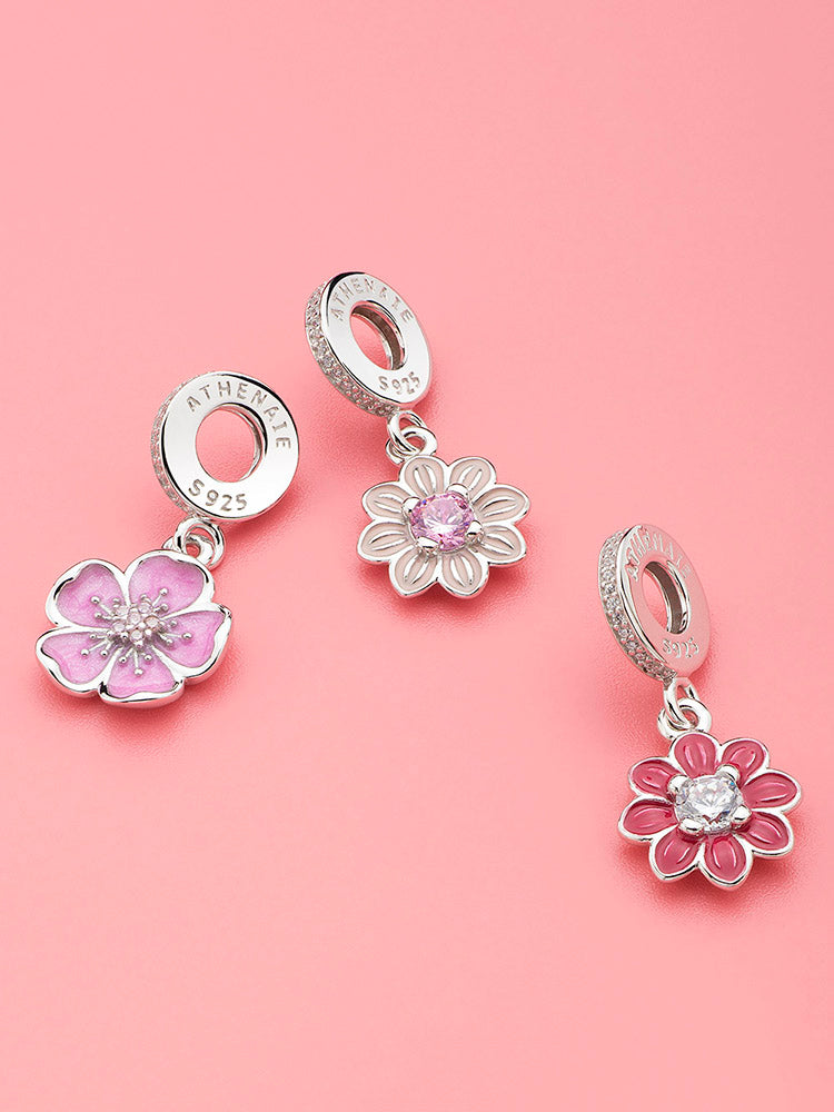 Charm bracelet look featuring plum blossom charm pendant