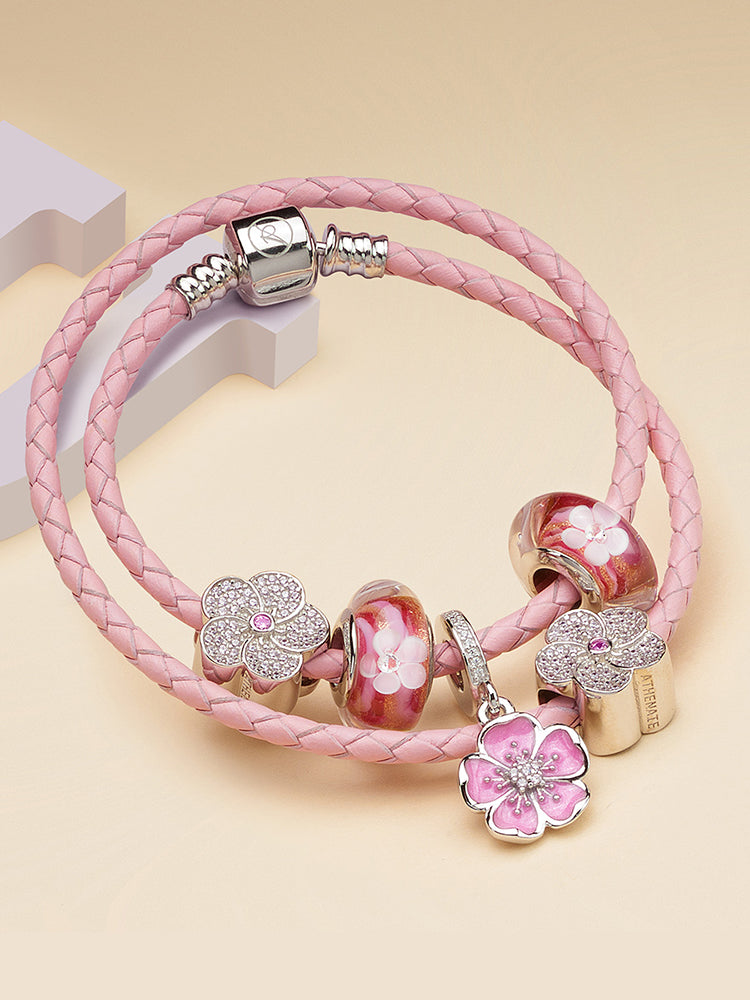 Plum blossom charm pendant styled on sterling silver charm bracelet