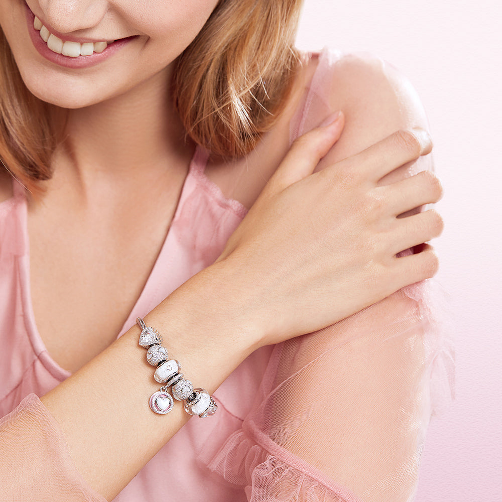 Lifestyle shot of Pure Promise Murano charm worn on wrist, elegant and meaningful gift for her, ATHENAIE charm bracelet