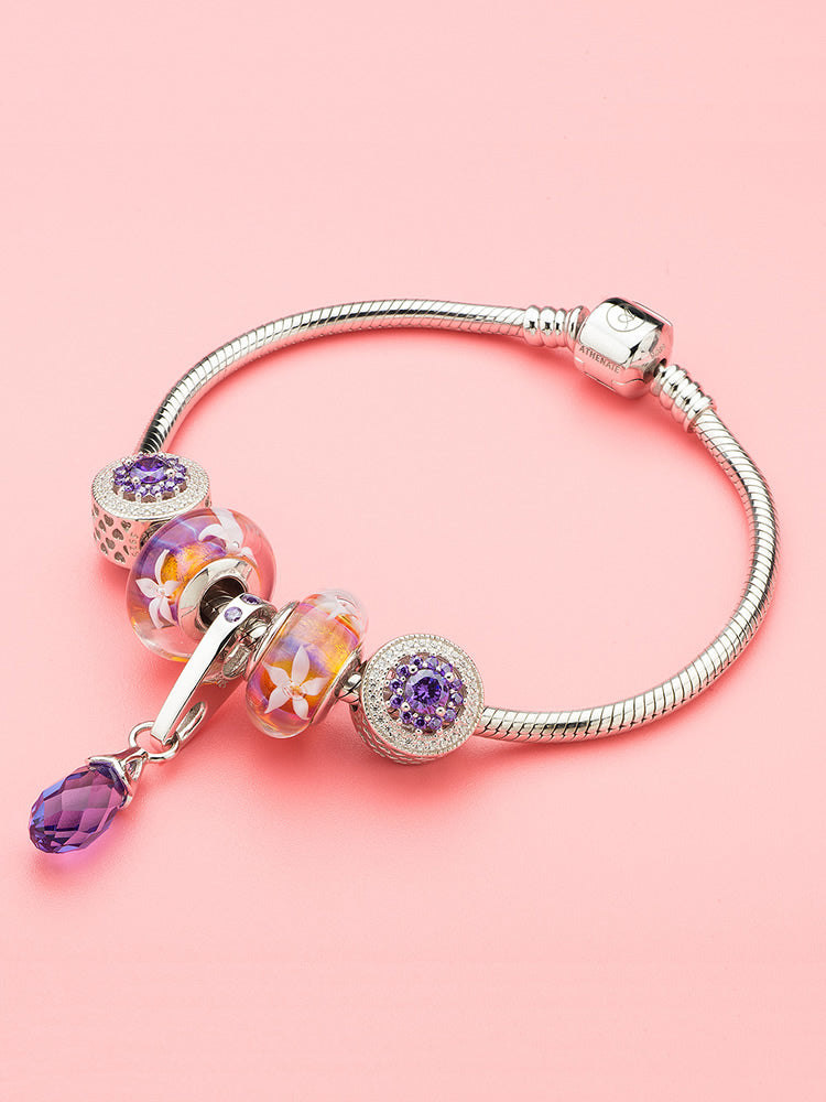 Purple jasmine flower Murano glass bead on a silver charm bracelet