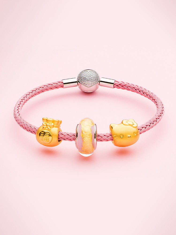 Purple pink braided charm bracelet with sterling silver heart clasp styled with charms