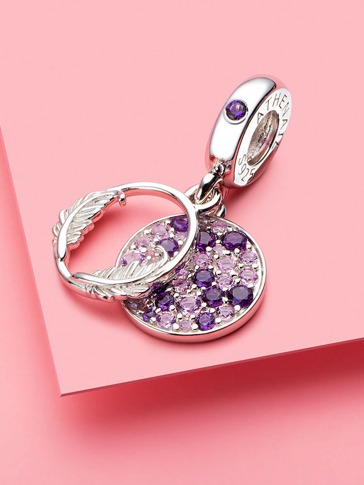 Purple wing circle sterling silver dangle charm styled on bracelet