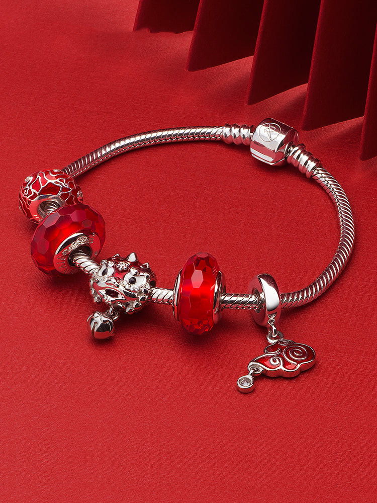 Red harmony charm bead styled on charm bracelet