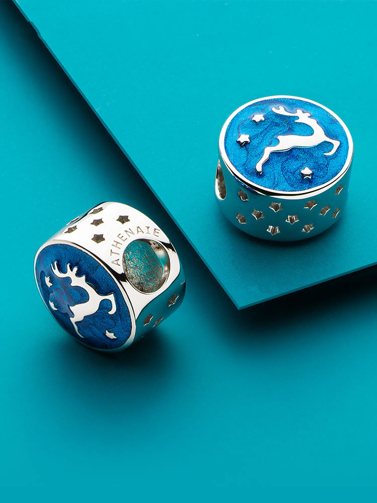 Starry reindeer Christmas charm styled on charm bracelet