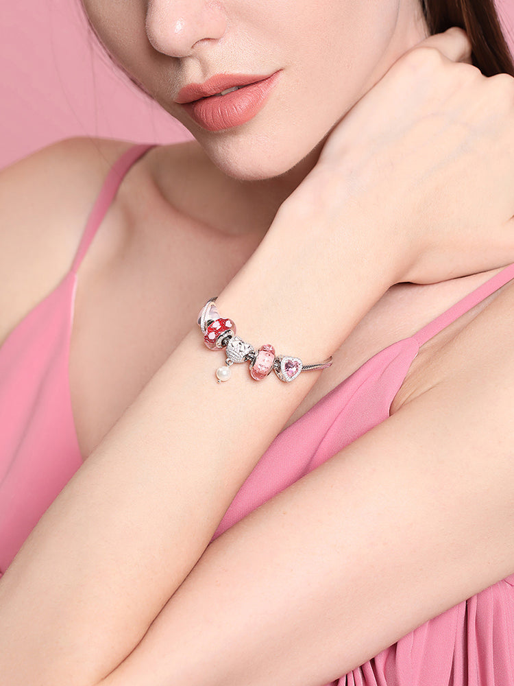 Pink embrace heart charm bead bracelet styling on model
