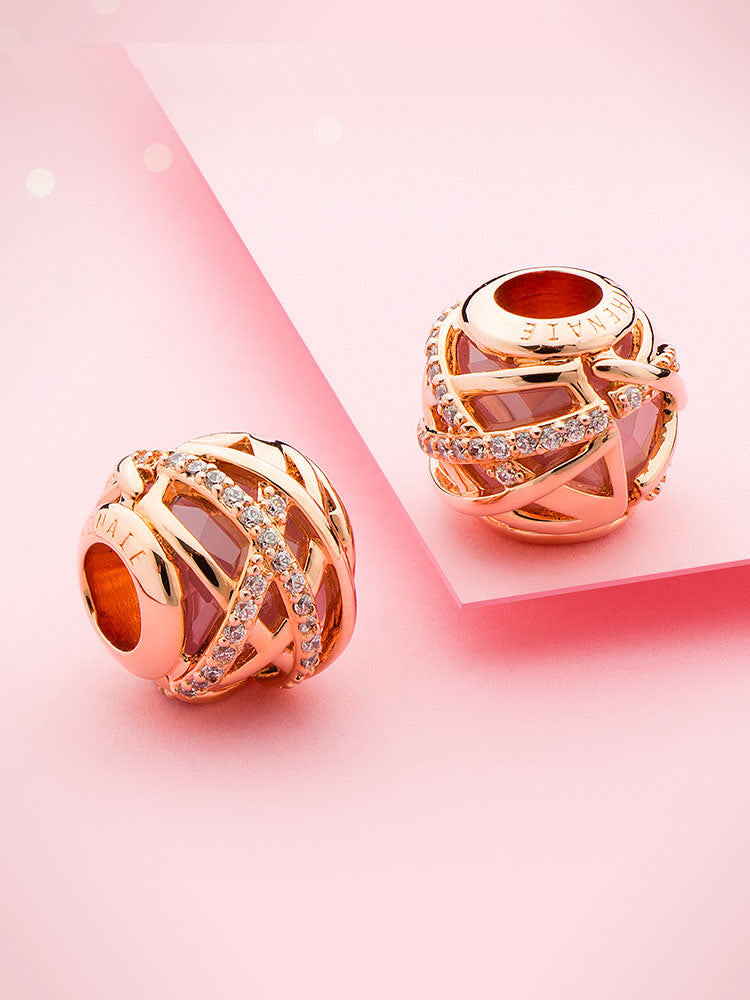 Rose gold charm bead styled on charm bracelet by ATHENAIE