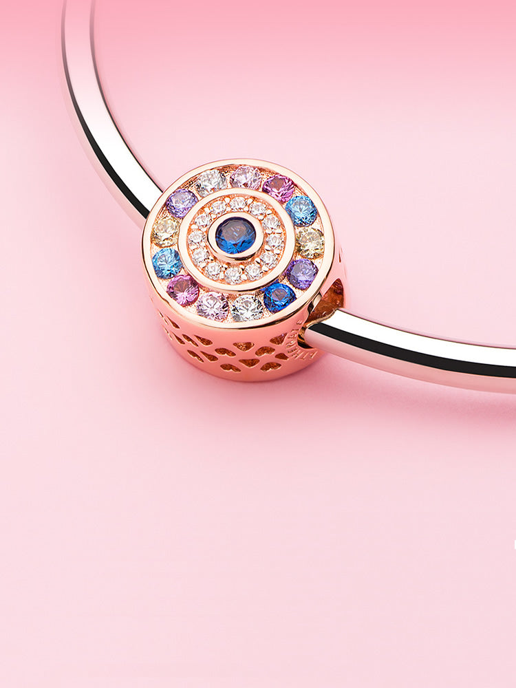 Rose gold charm bead styled on charm bracelet by ATHENAIE