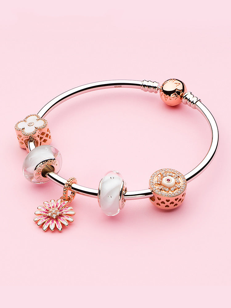 Rose gold daisy dangle charm bracelet styling by ATHENAIE