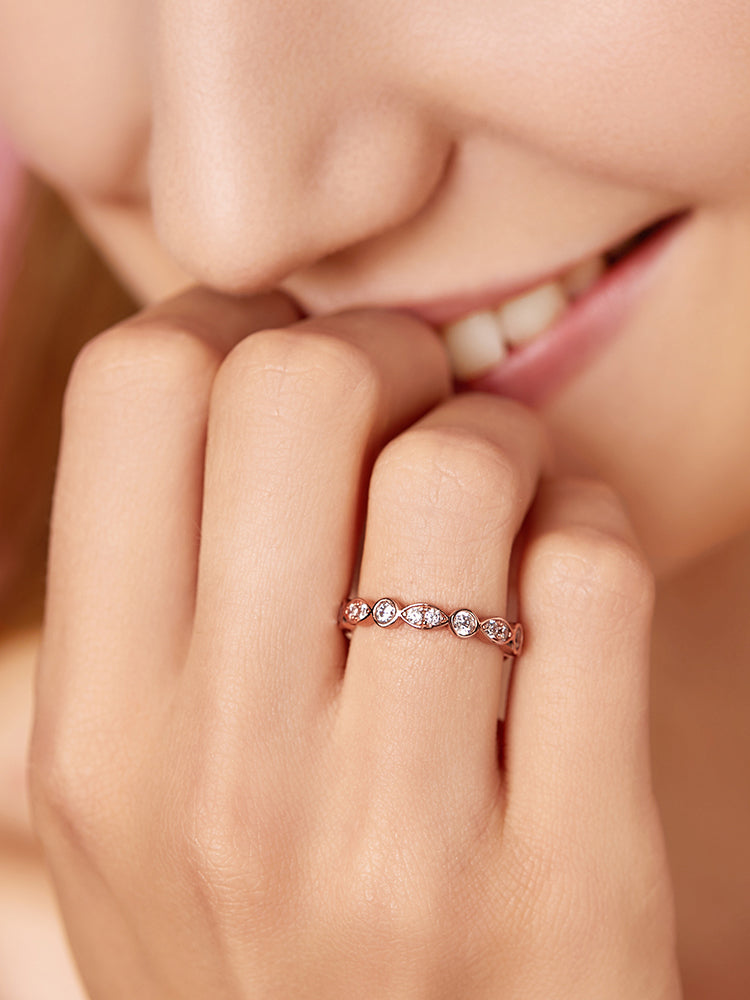 Rose gold marquise CZ eternity band ring on hand