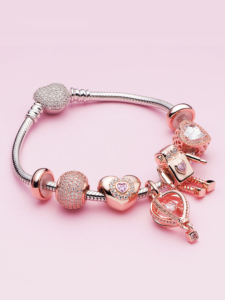 Rose gold stopper charm bead styled on charm bracelet by ATHENAIE