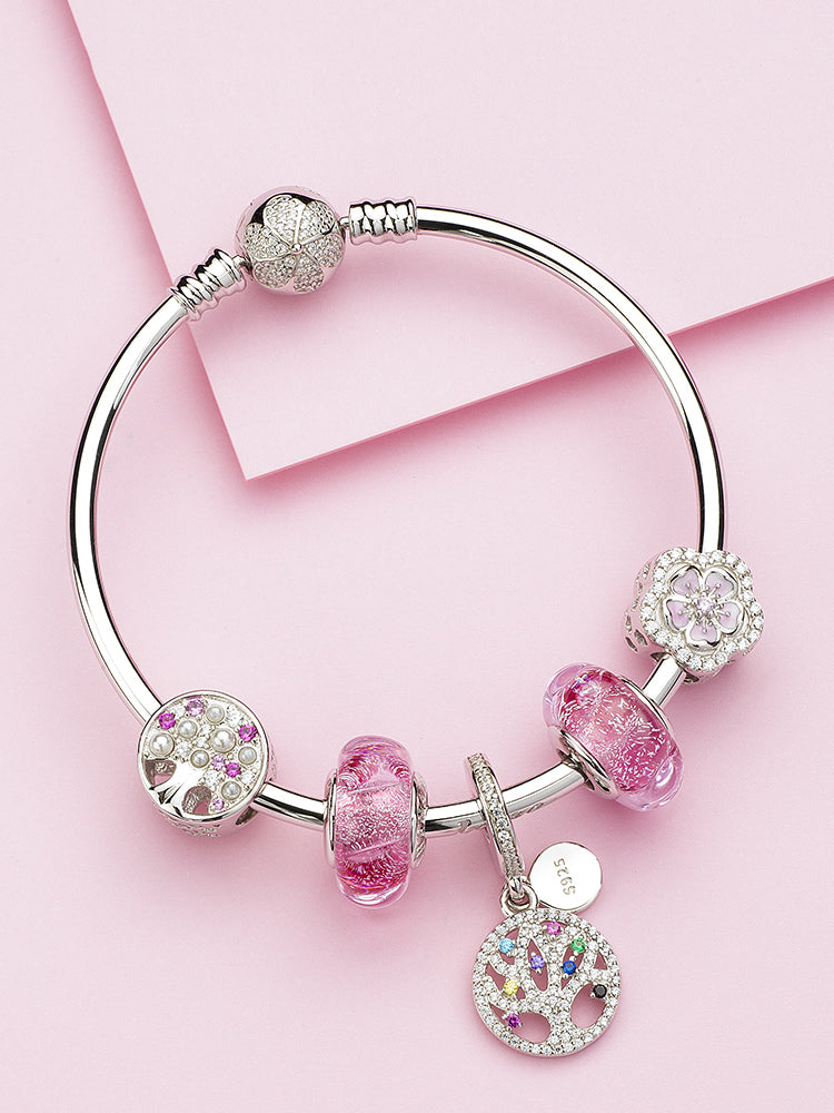 Rose pink wave Murano glass bead on a silver charm bracelet