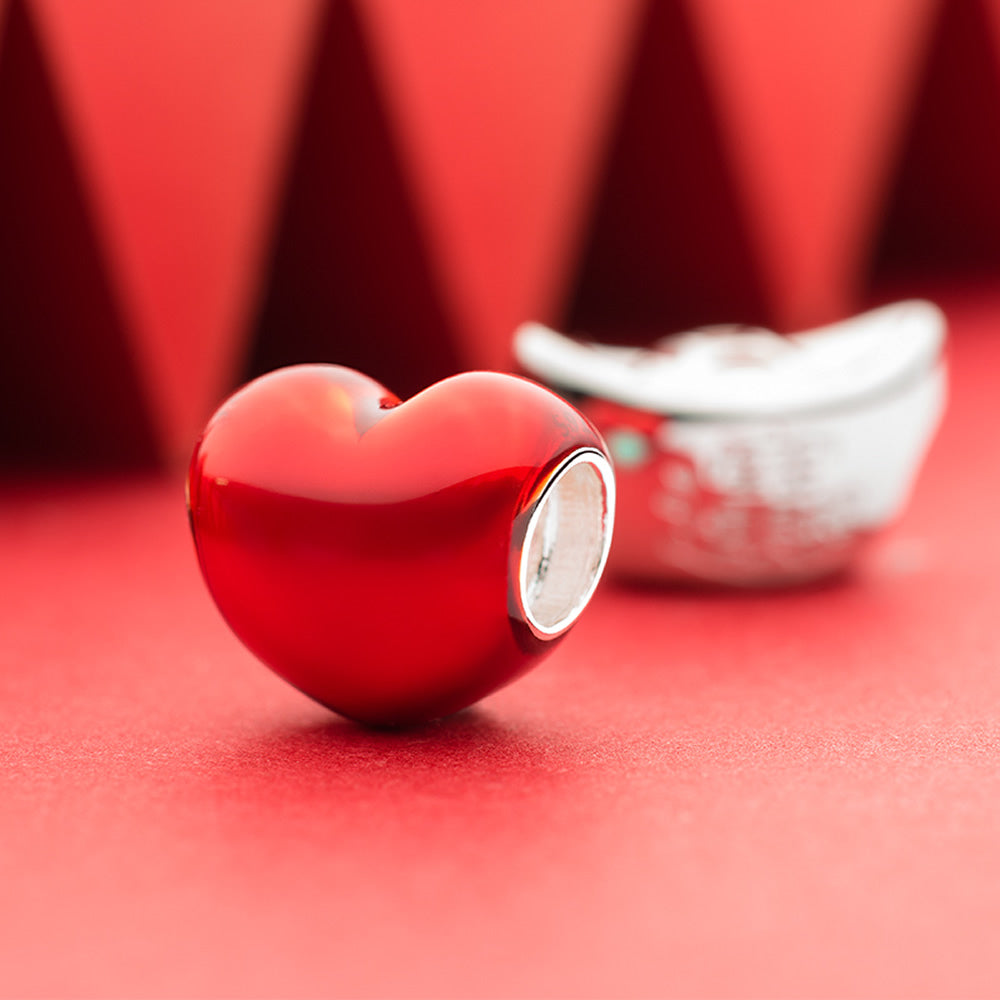 Close-up of Ruby Heart 925 silver enamel charm bead with red enamel finish.