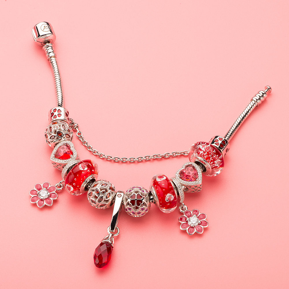 Red CZ Scarlet Bloom charm styled with matching red-themed bracelet