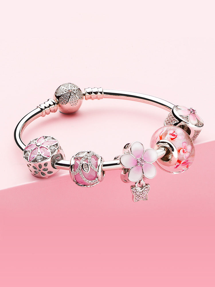 Rosy blossom spacer charm styled with charm bracelet beads