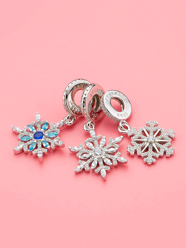 Blue snowflake charm styled on bracelet
