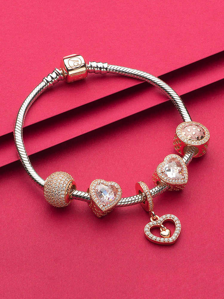 Rose gold heart charm styled on European-style bracelet