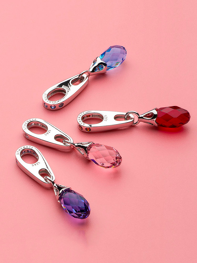 Purple crystal dangle charm styled on bracelet