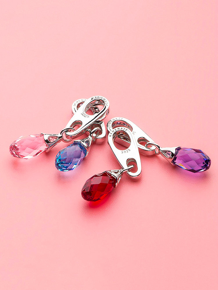 Pink crystal dangle charm styled on bracelet