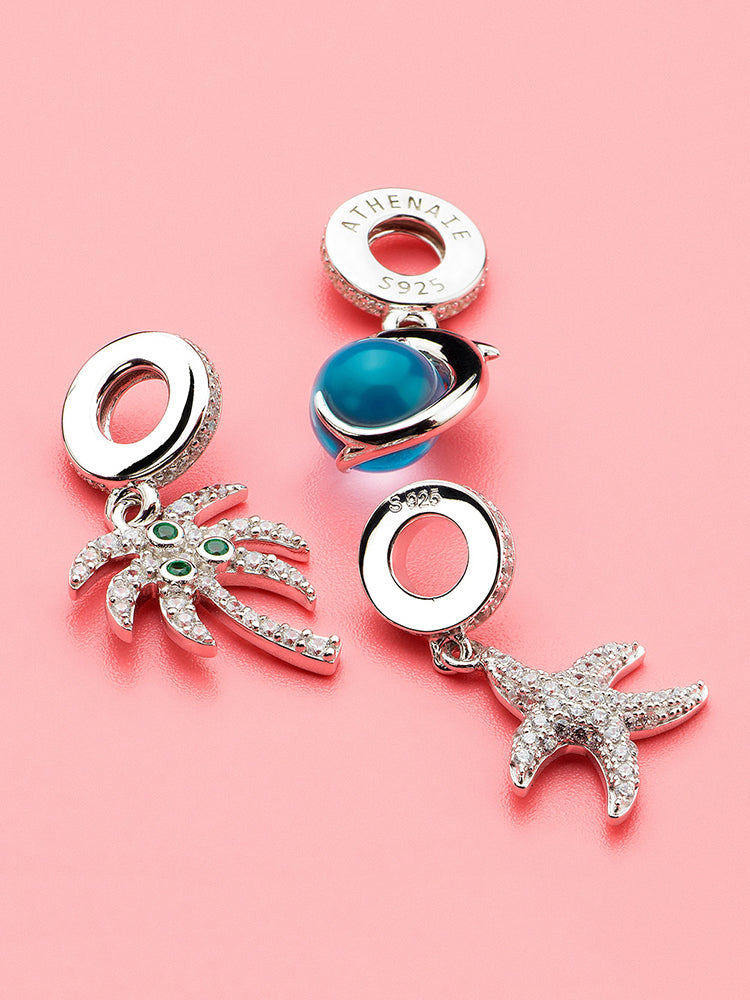 Aqua dolphin dangle charm paired with bracelet